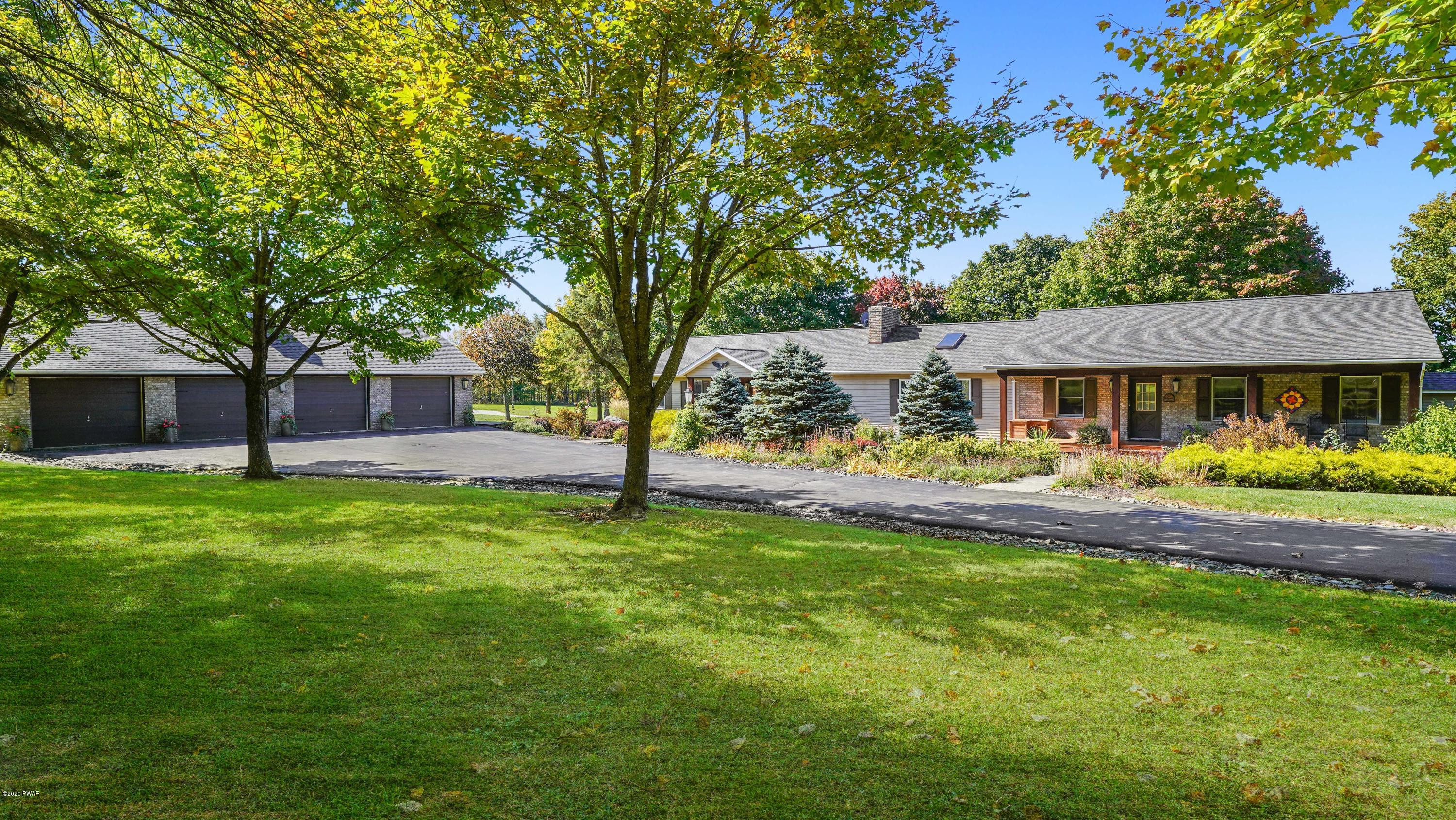 161 J J Road Moscow, PA 18444 - Photo 6 of 73 a front view of a house with yard and green space