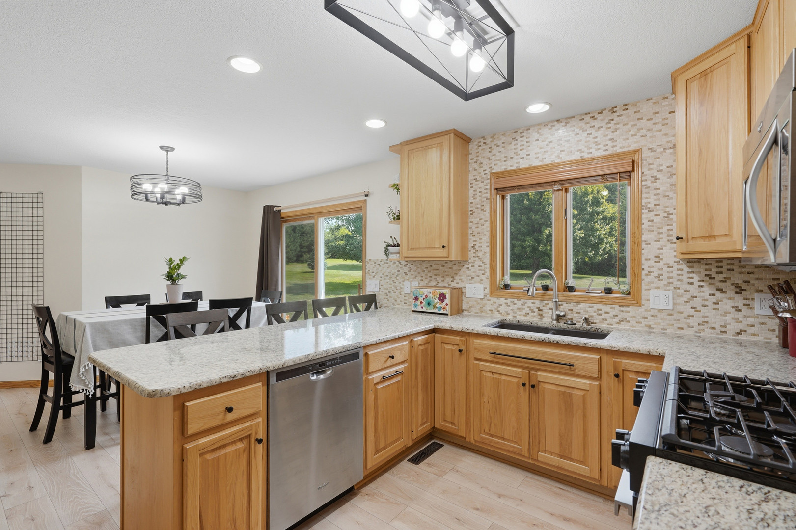 2237 Hickory Hills Road Muscatine, IA 52761 - Photo 9 of 53 a kitchen with a sink stove and cabinets