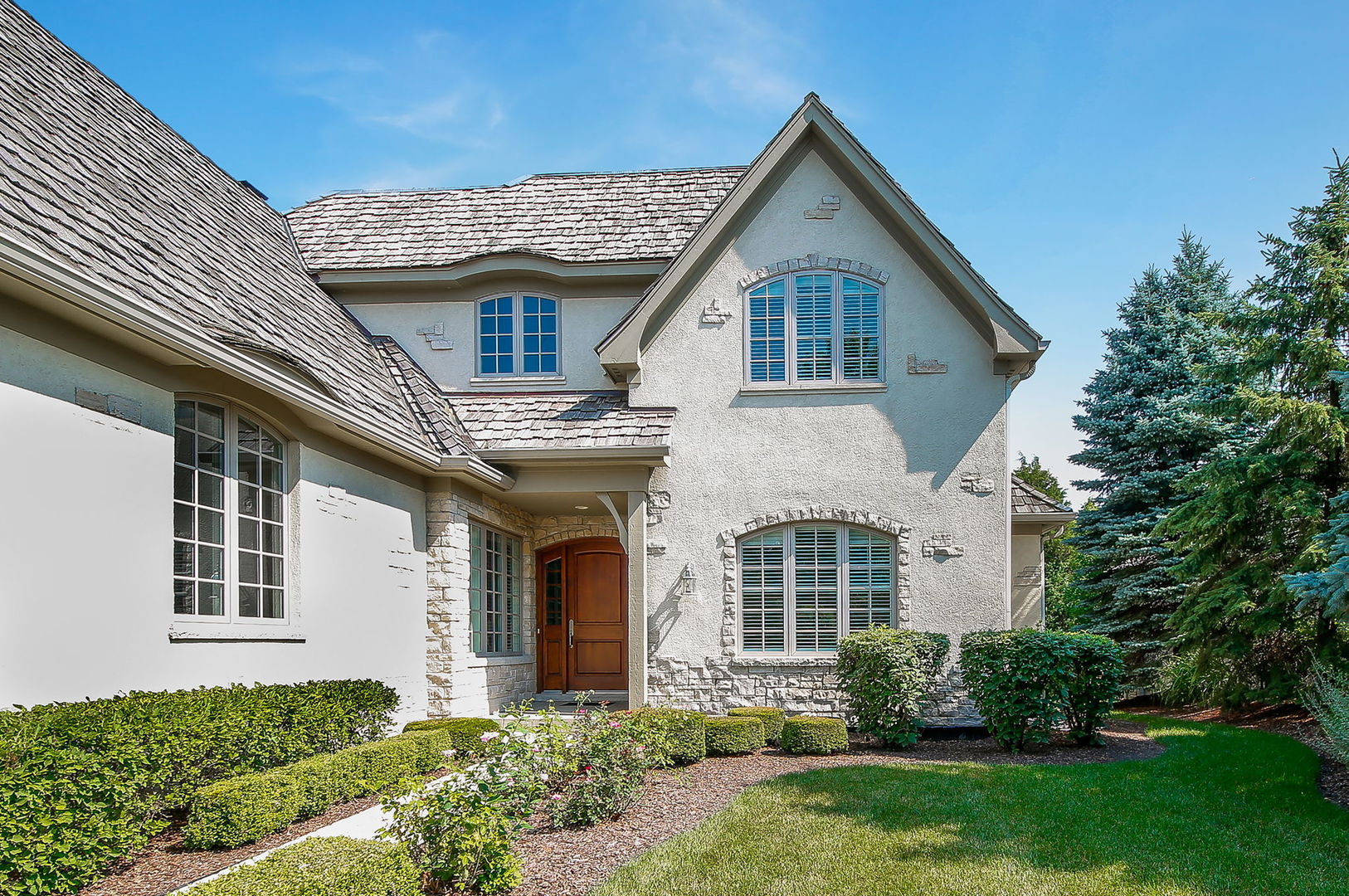 65 Forest Gate Circle Oak Brook, IL 60523 - Photo 2 of 14 front view of a house with a yard