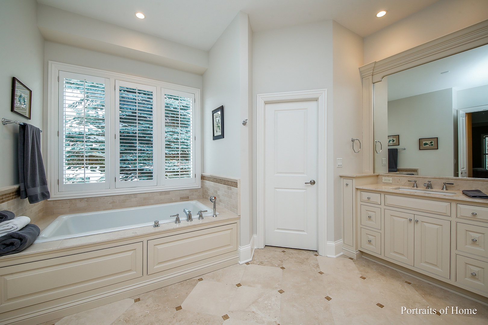 65 Forest Gate Circle Oak Brook, IL 60523 - Photo 11 of 14 a bathroom with a tub sink and mirror