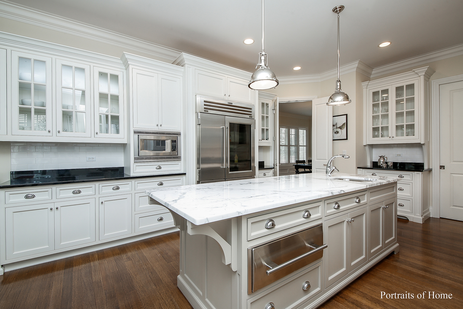 65 Forest Gate Circle Oak Brook, IL 60523 - Photo 3 of 14 a kitchen with stainless steel appliances granite countertop a stove and a sink
