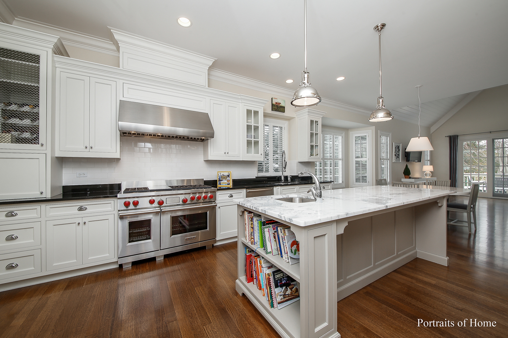 65 Forest Gate Circle Oak Brook, IL 60523 - Photo 5 of 14 a large kitchen with stainless steel appliances granite countertop a stove and a wooden floors