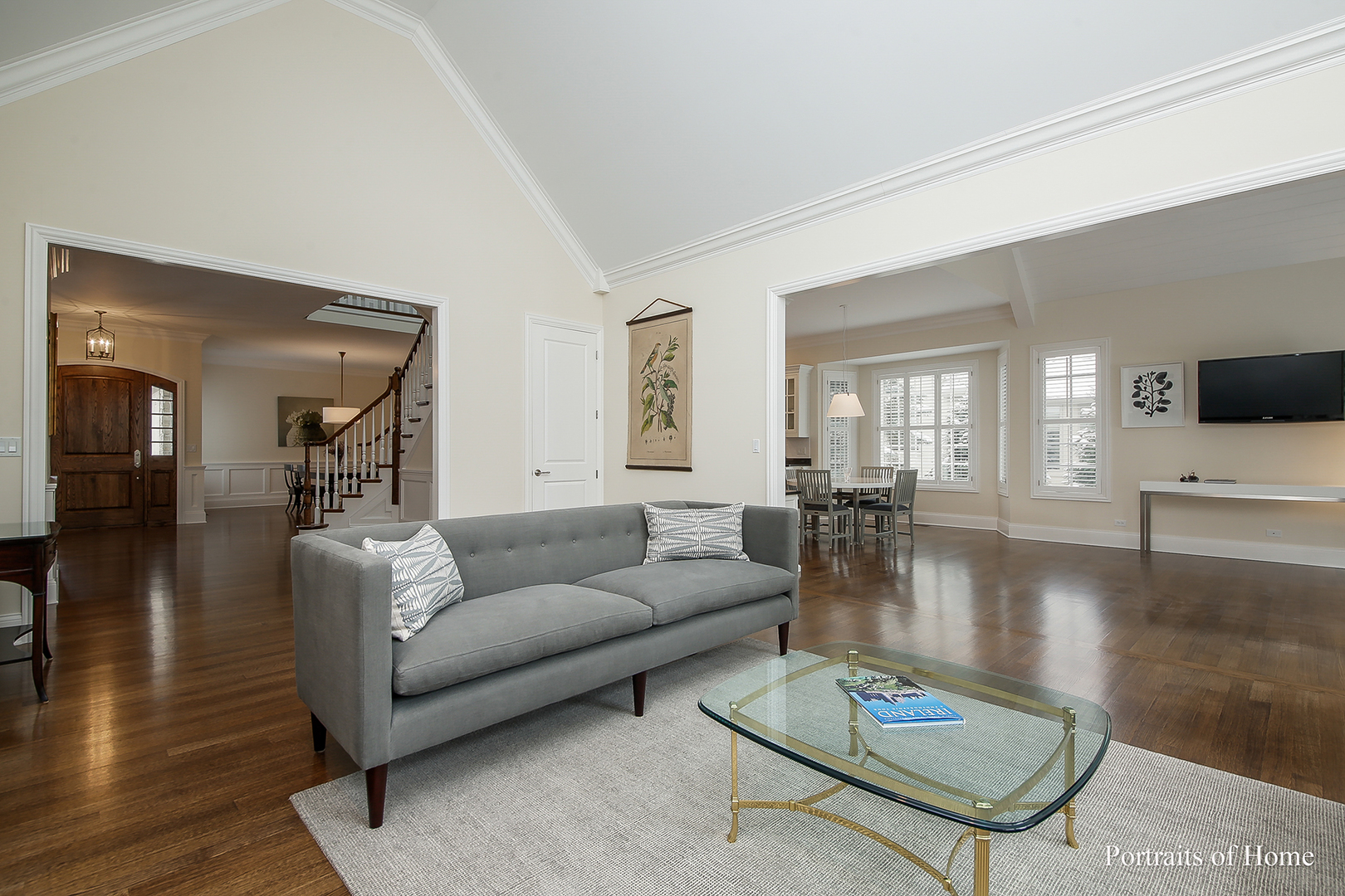 65 Forest Gate Circle Oak Brook, IL 60523 - Photo 9 of 14 a living room with furniture a flat screen tv and wooden floor