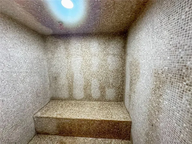 a room with furniture a window and a potted plant