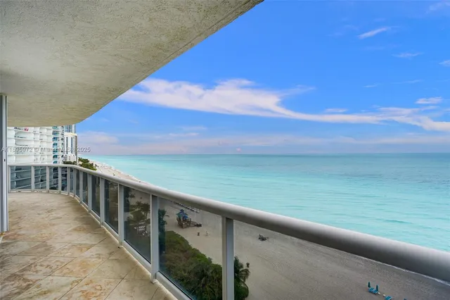 a view of a balcony with an ocean view