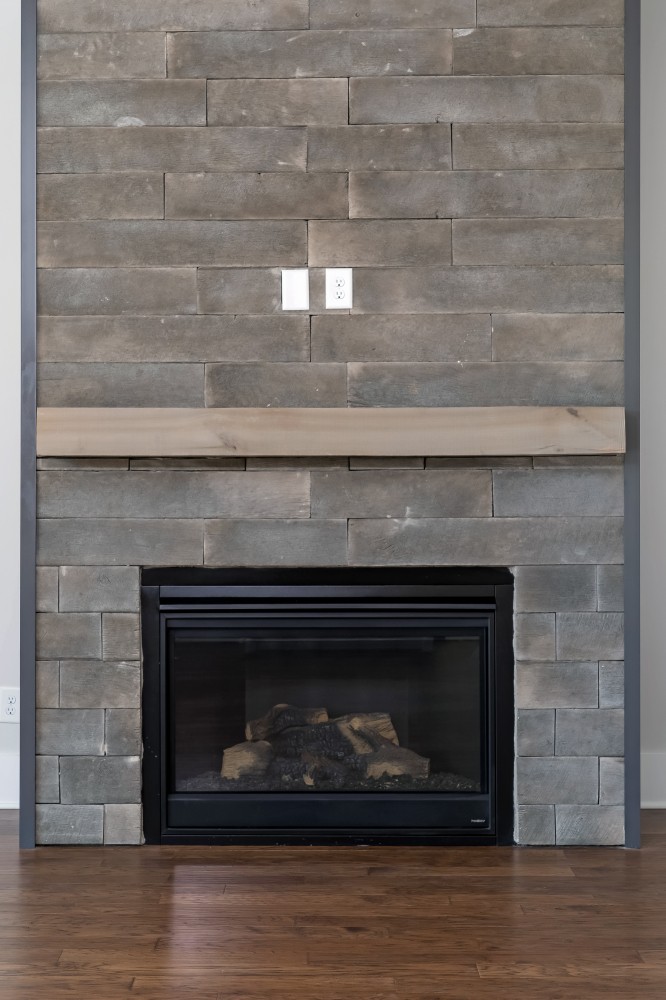 997 Spruce Ridge Lane Spring Hill, TN 37174 - Photo 11 of 30 a fireplace with a hallway