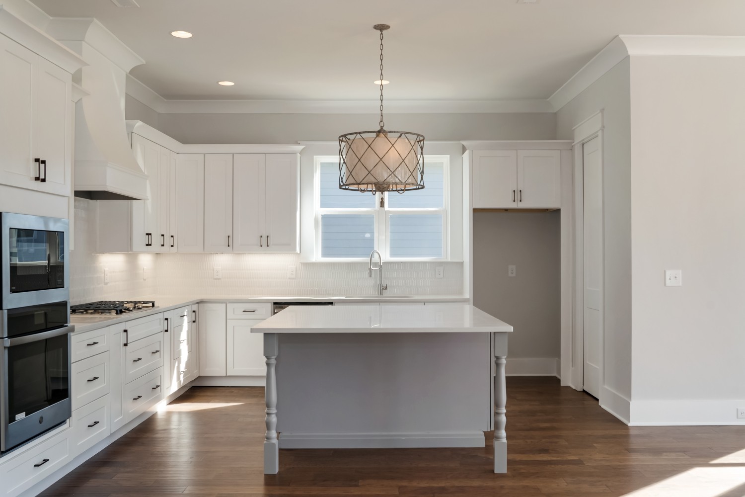 997 Spruce Ridge Lane Spring Hill, TN 37174 - Photo 12 of 30 a kitchen with stainless steel appliances granite countertop a sink cabinets and wooden floor