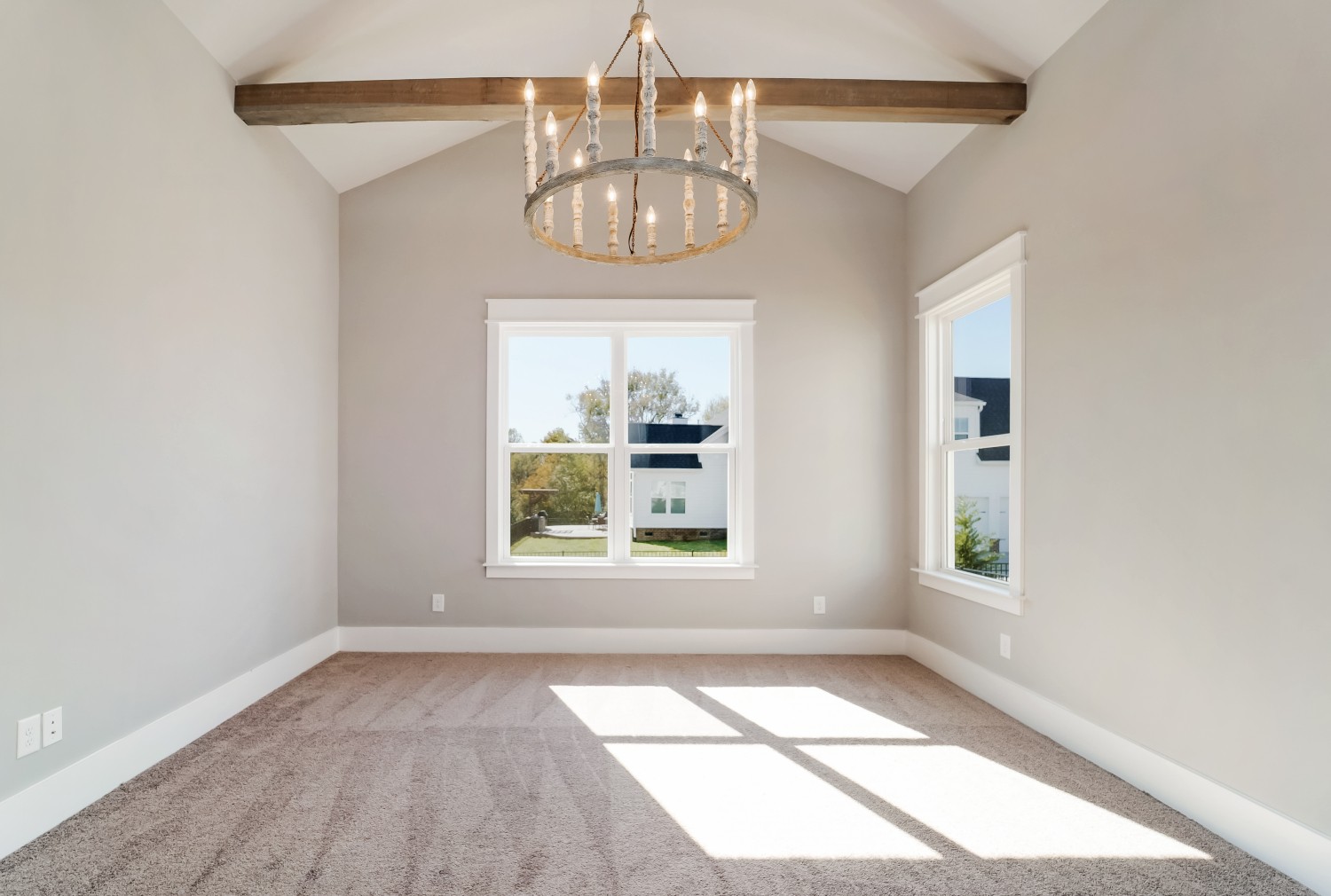 997 Spruce Ridge Lane Spring Hill, TN 37174 - Photo 19 of 30 an empty room with a chandelier fan and windows