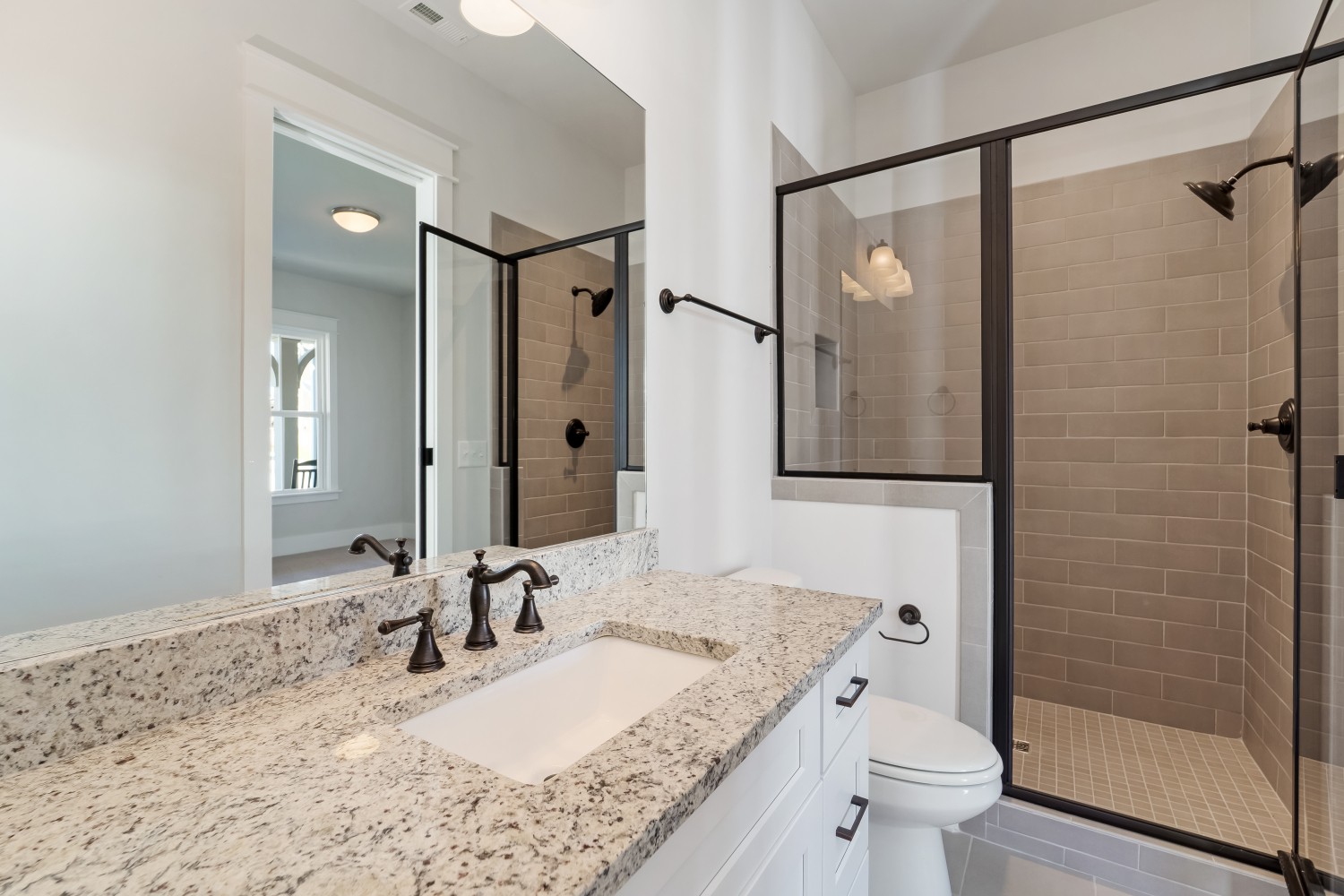 997 Spruce Ridge Lane Spring Hill, TN 37174 - Photo 27 of 30 a bathroom with a granite countertop sink toilet and shower
