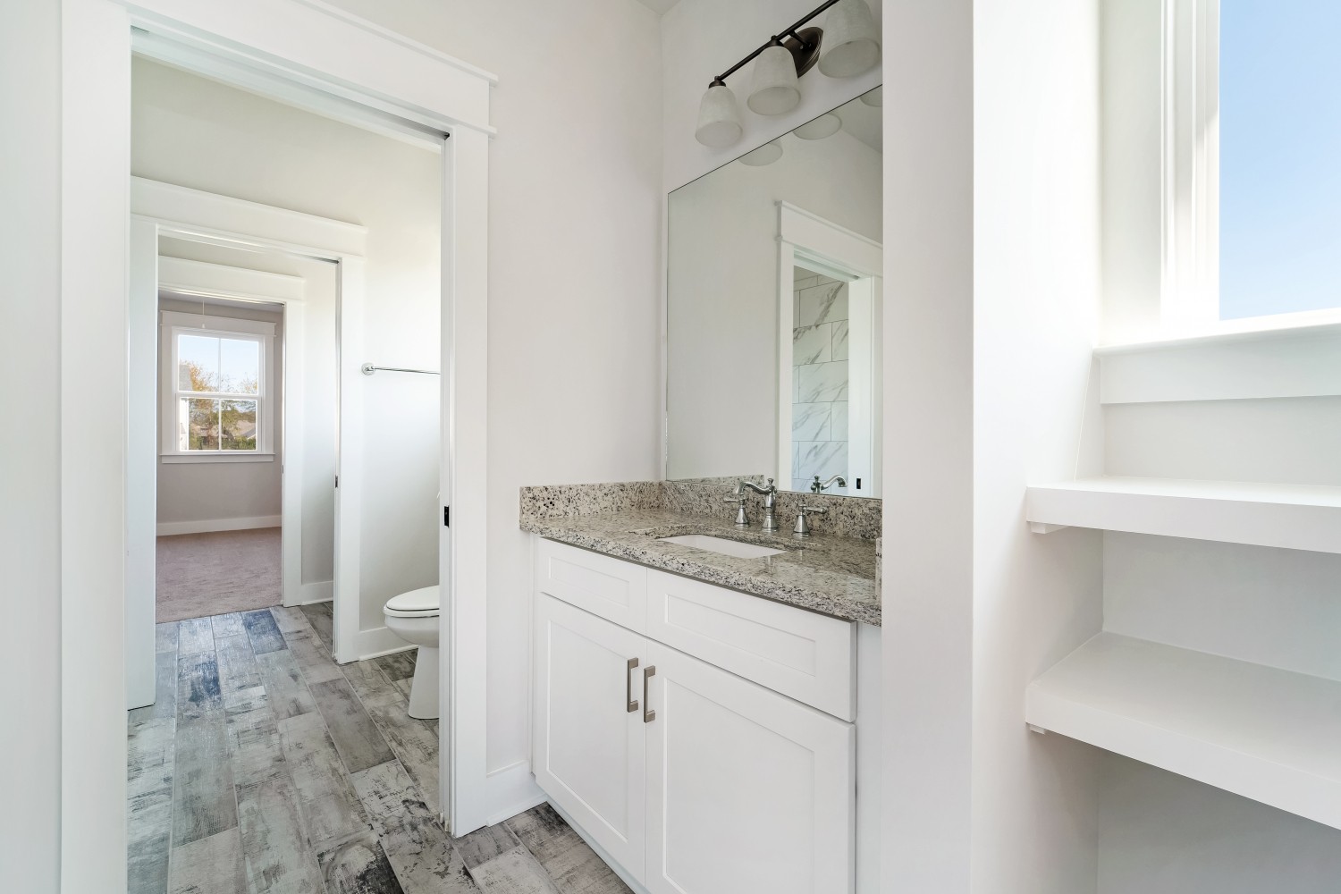 997 Spruce Ridge Lane Spring Hill, TN 37174 - Photo 29 of 30 a bathroom with a granite countertop sink and a toilet