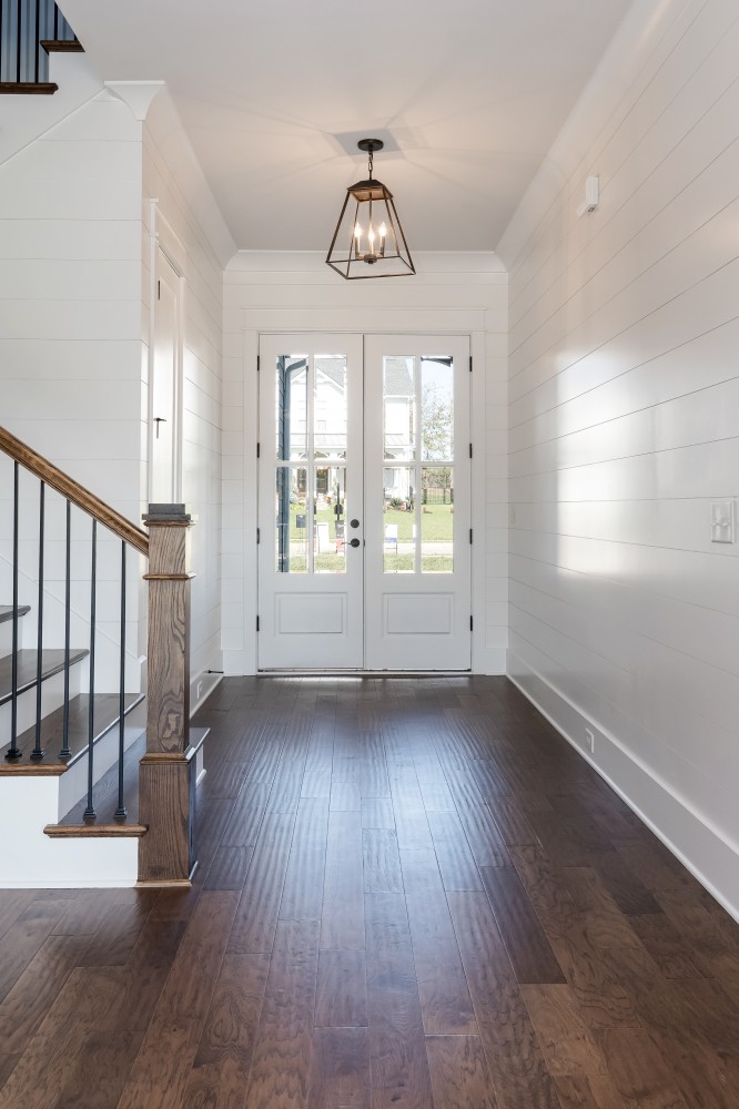 997 Spruce Ridge Lane Spring Hill, TN 37174 - Photo 5 of 30 an empty room with wooden floor fan and windows
