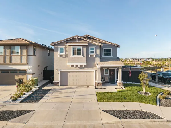 a front view of a house with swimming pool