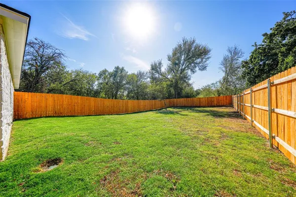 a view of backyard with green space