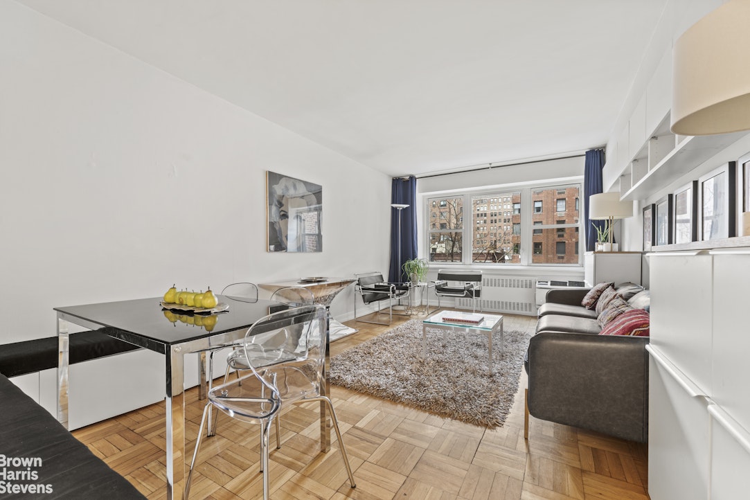 a living room with furniture and a window