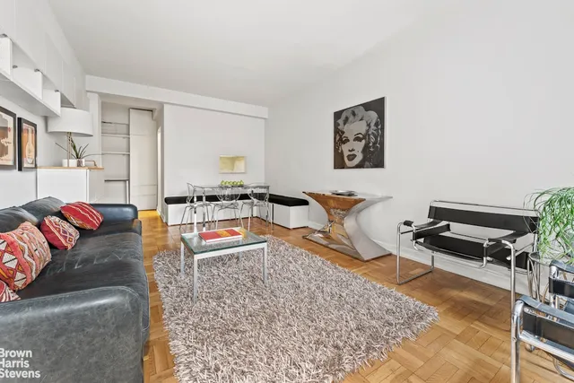 a living room with furniture and a rug