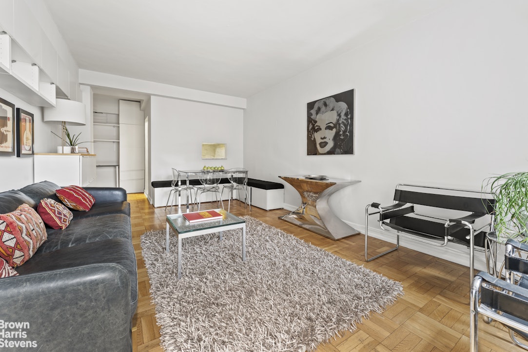 11 Riverside Drive, Unit 7PW Manhattan, NY 10023 - Photo 2 of 14 a living room with furniture and a rug