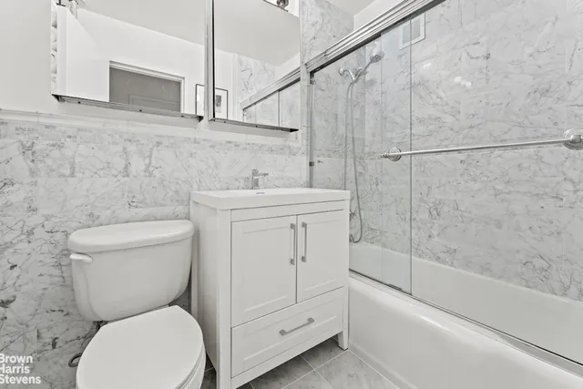 a bathroom with a toilet sink and bathtub