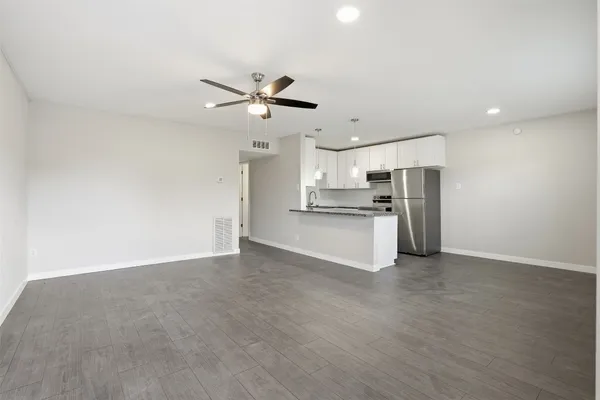 a front view of a building with sitting area