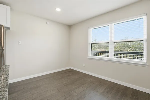 a kitchen with a refrigerator stove and sink