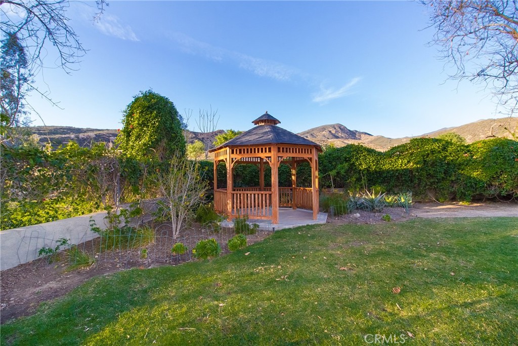 14941 Wildcat Canyon Road Silverado, CA 92676 - Photo 15 of 18 a view of a house with a yard and sitting area