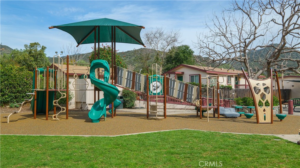14941 Wildcat Canyon Road Silverado, CA 92676 - Photo 16 of 18 a view of a building with a yard