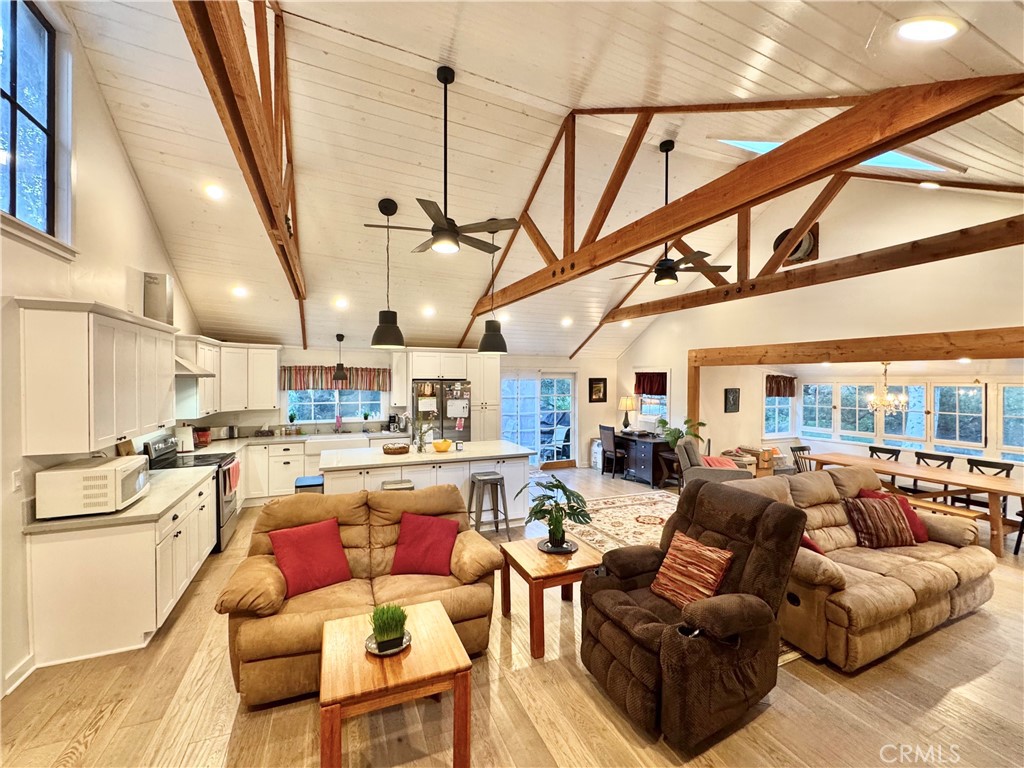 14941 Wildcat Canyon Road Silverado, CA 92676 - Photo 4 of 18 a living room with fireplace furniture and a large window