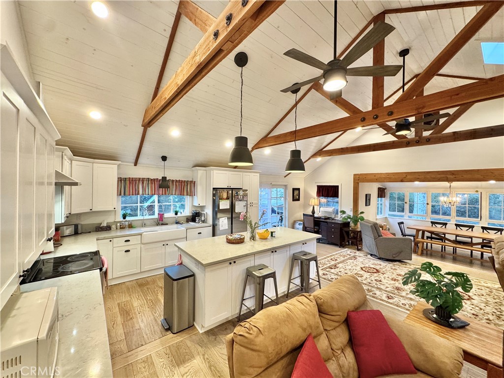 14941 Wildcat Canyon Road Silverado, CA 92676 - Photo 5 of 18 a living room with lots of furniture and kitchen view