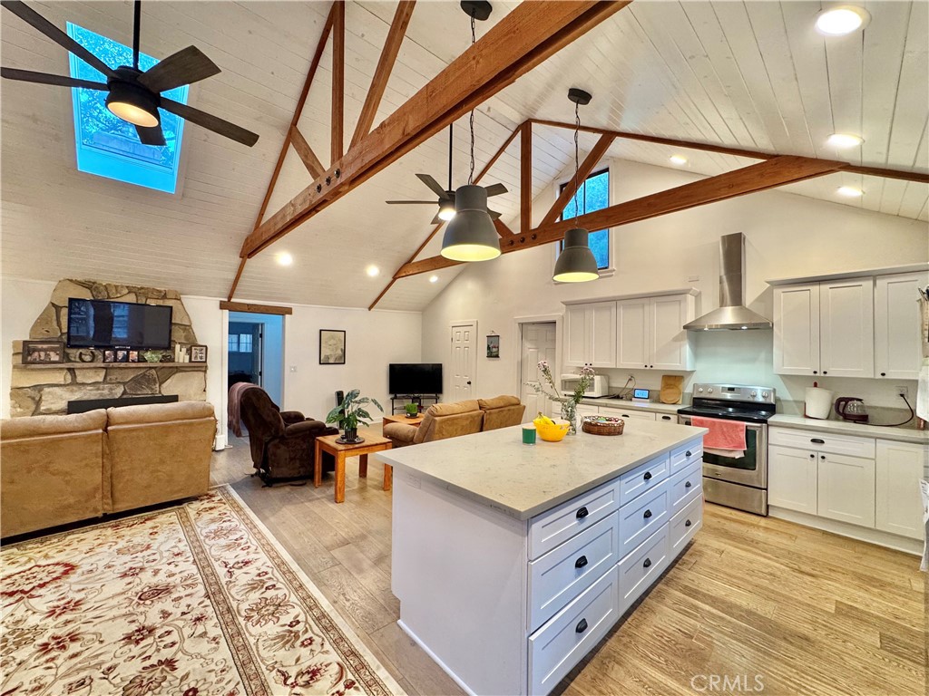 14941 Wildcat Canyon Road Silverado, CA 92676 - Photo 18 of 18 a large kitchen with a stove a sink dishwasher and a refrigerator with wooden floor