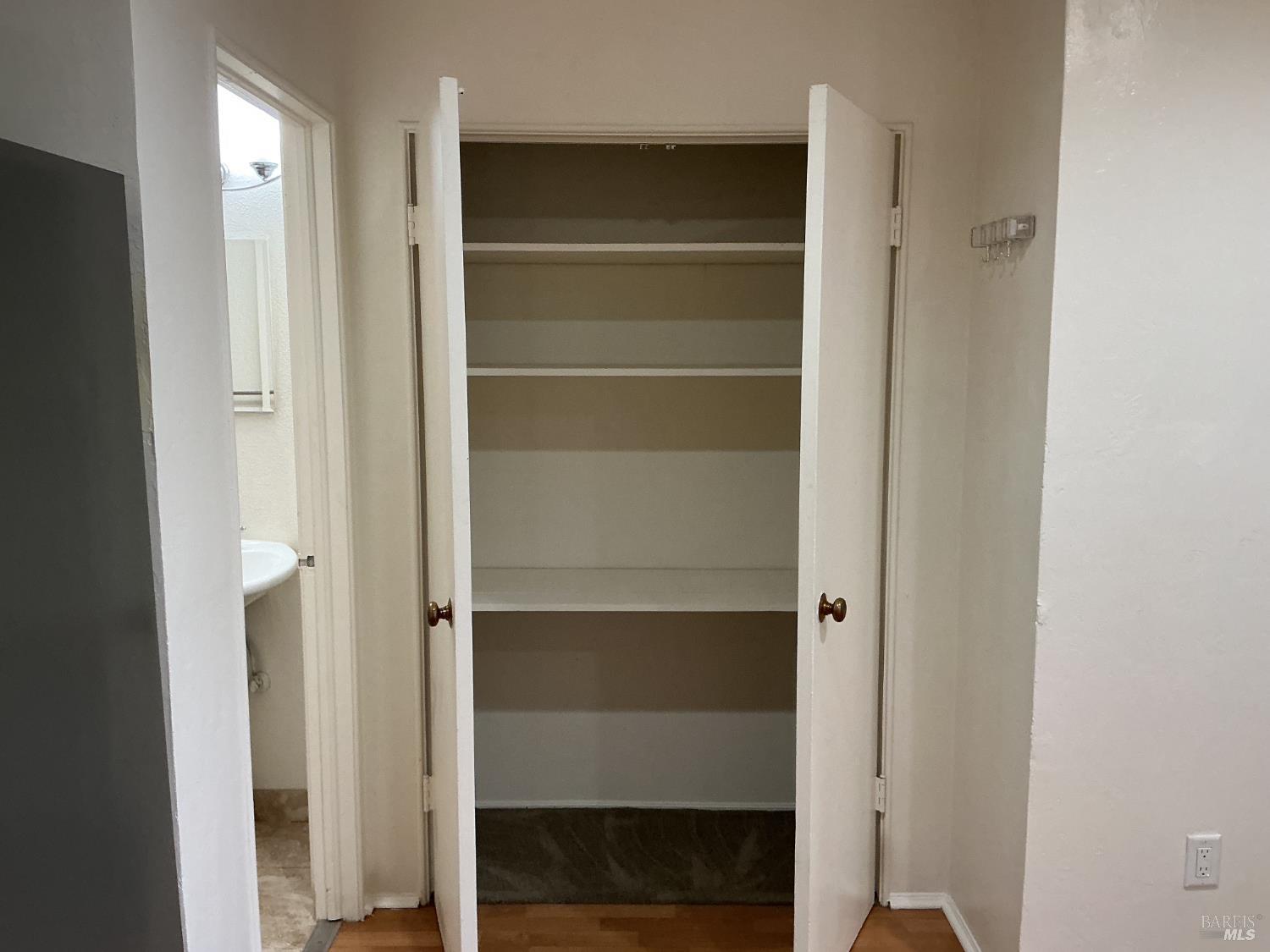 212 South E Street, Unit B Santa Rosa, CA 95404 - Photo 11 of 31 a view of walk in closet with empty racks