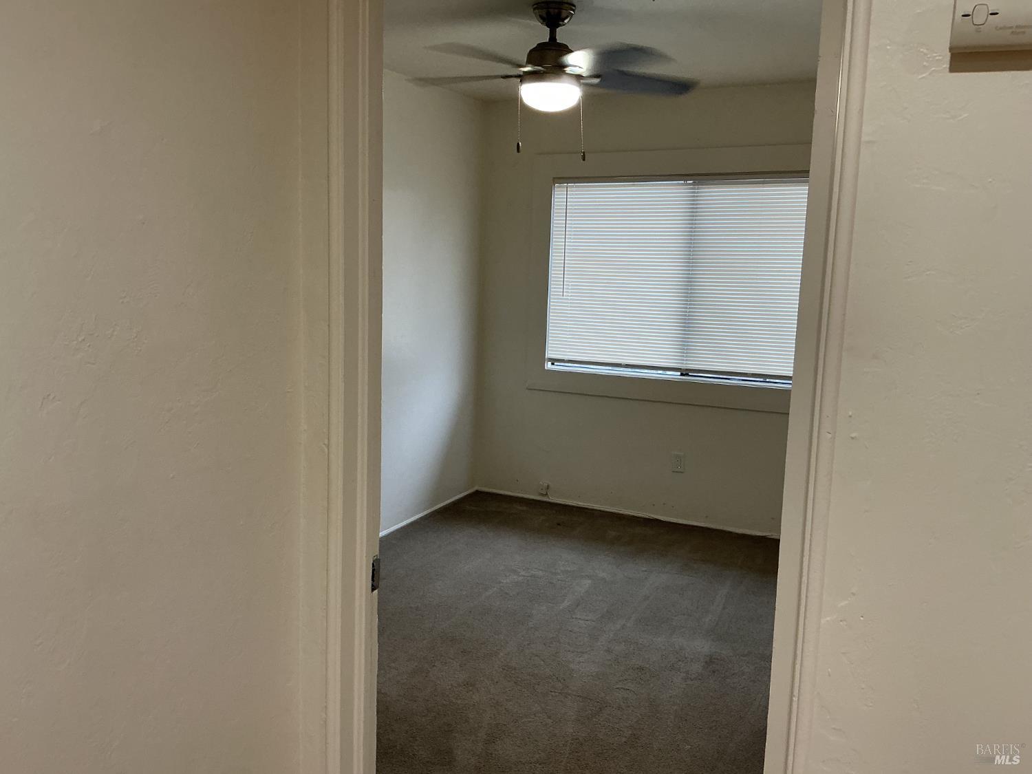 212 South E Street, Unit B Santa Rosa, CA 95404 - Photo 13 of 31 a view of an empty room with a window