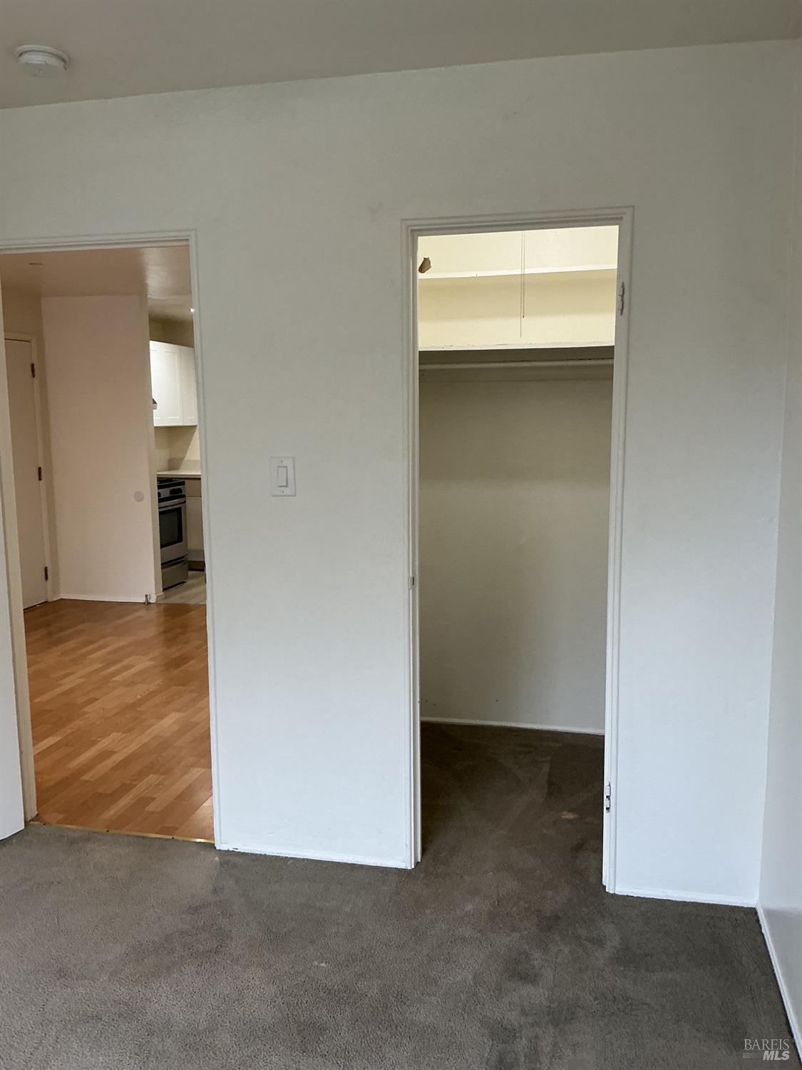 212 South E Street, Unit B Santa Rosa, CA 95404 - Photo 15 of 31 an empty room with wooden floor & cabinet