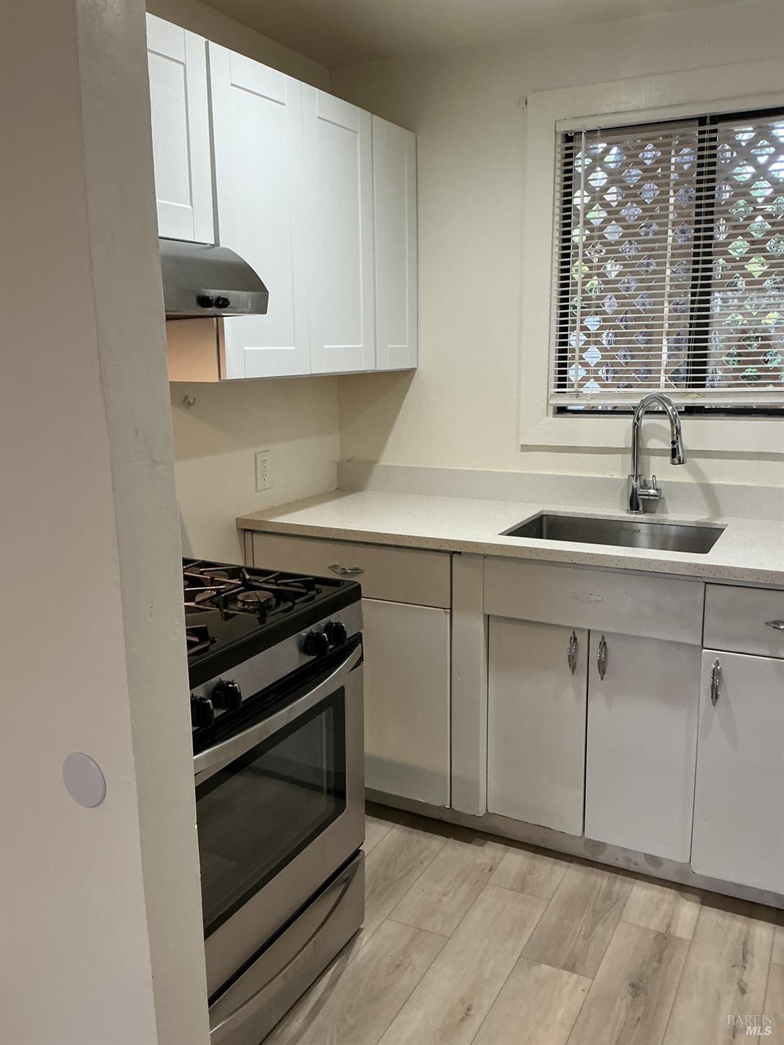 212 South E Street, Unit B Santa Rosa, CA 95404 - Photo 17 of 31 a kitchen with cabinets appliances and a sink