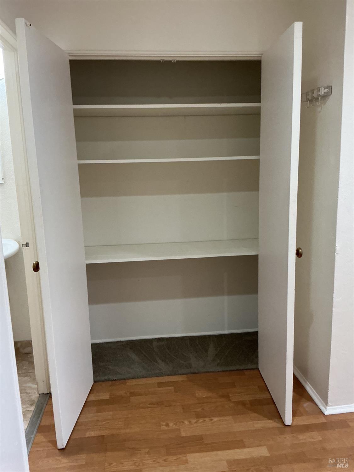 212 South E Street, Unit B Santa Rosa, CA 95404 - Photo 19 of 31 a view of storage and utility room with wooden floor