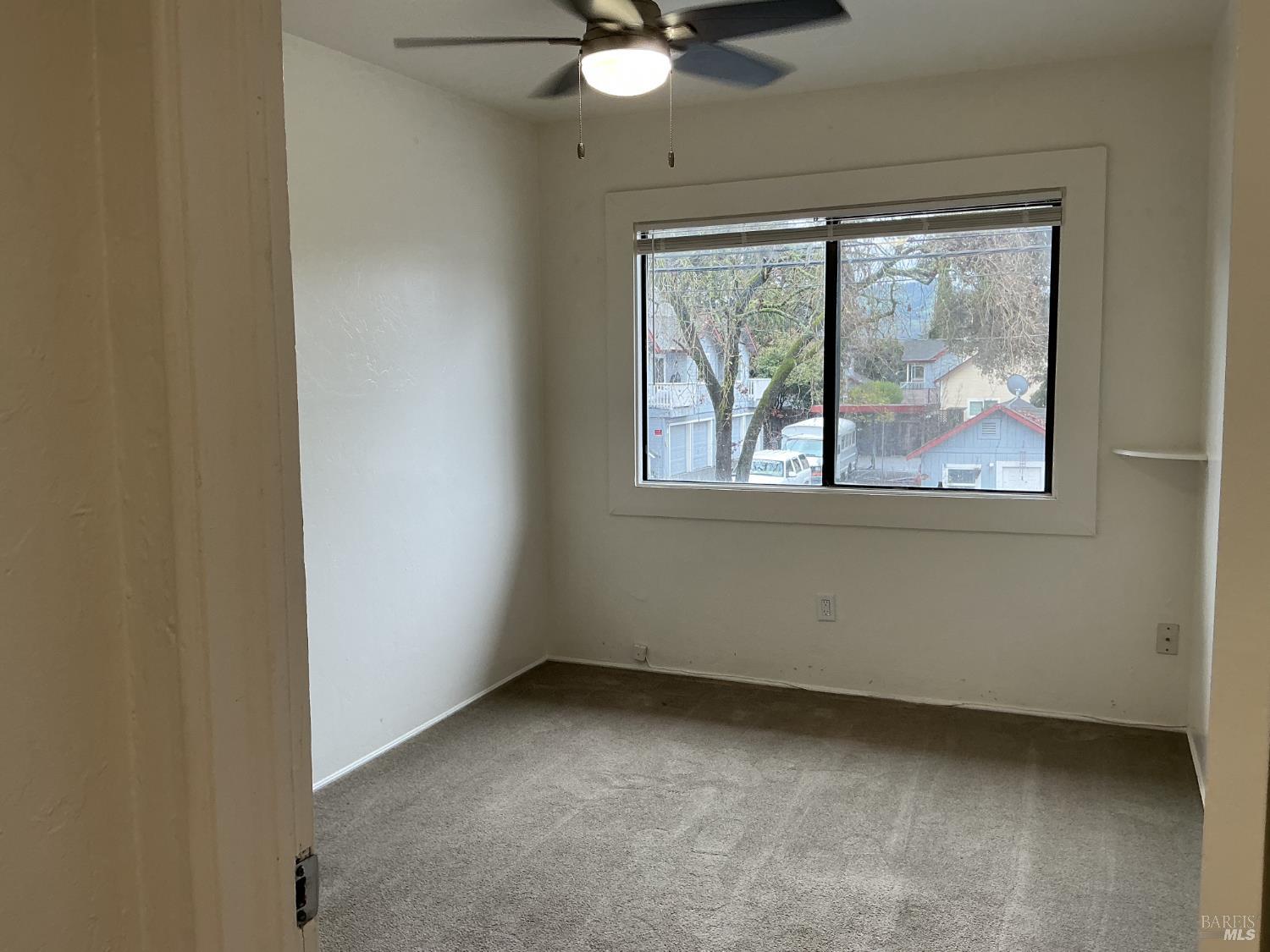212 South E Street, Unit B Santa Rosa, CA 95404 - Photo 21 of 31 an empty room with a window