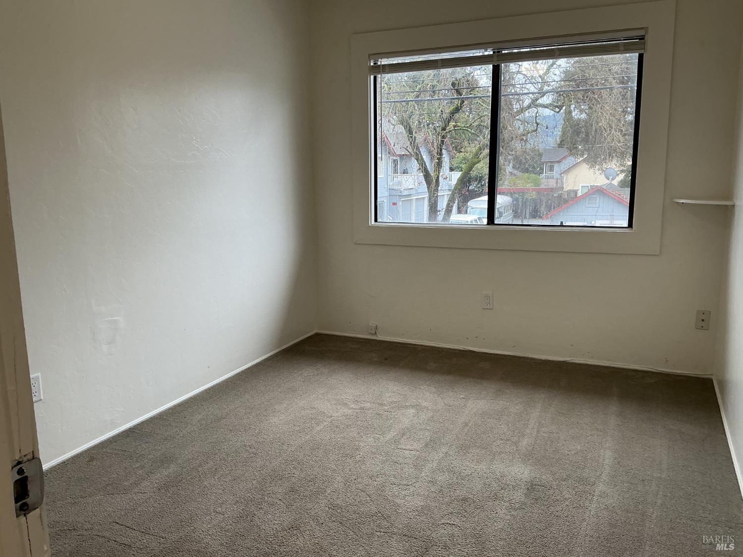 212 South E Street, Unit B Santa Rosa, CA 95404 - Photo 22 of 31 an empty room with a window