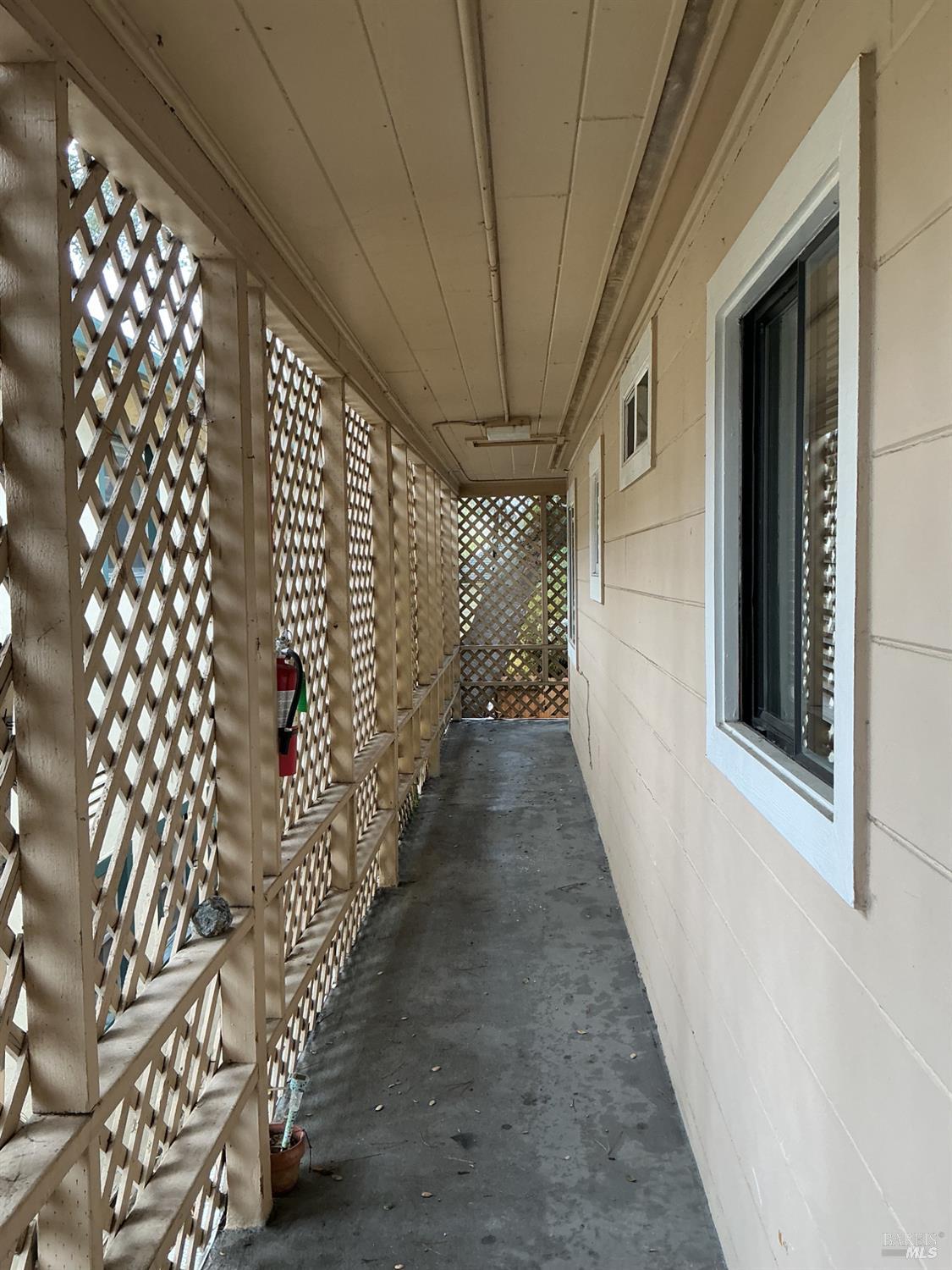 212 South E Street, Unit B Santa Rosa, CA 95404 - Photo 26 of 31 a hallway with windows