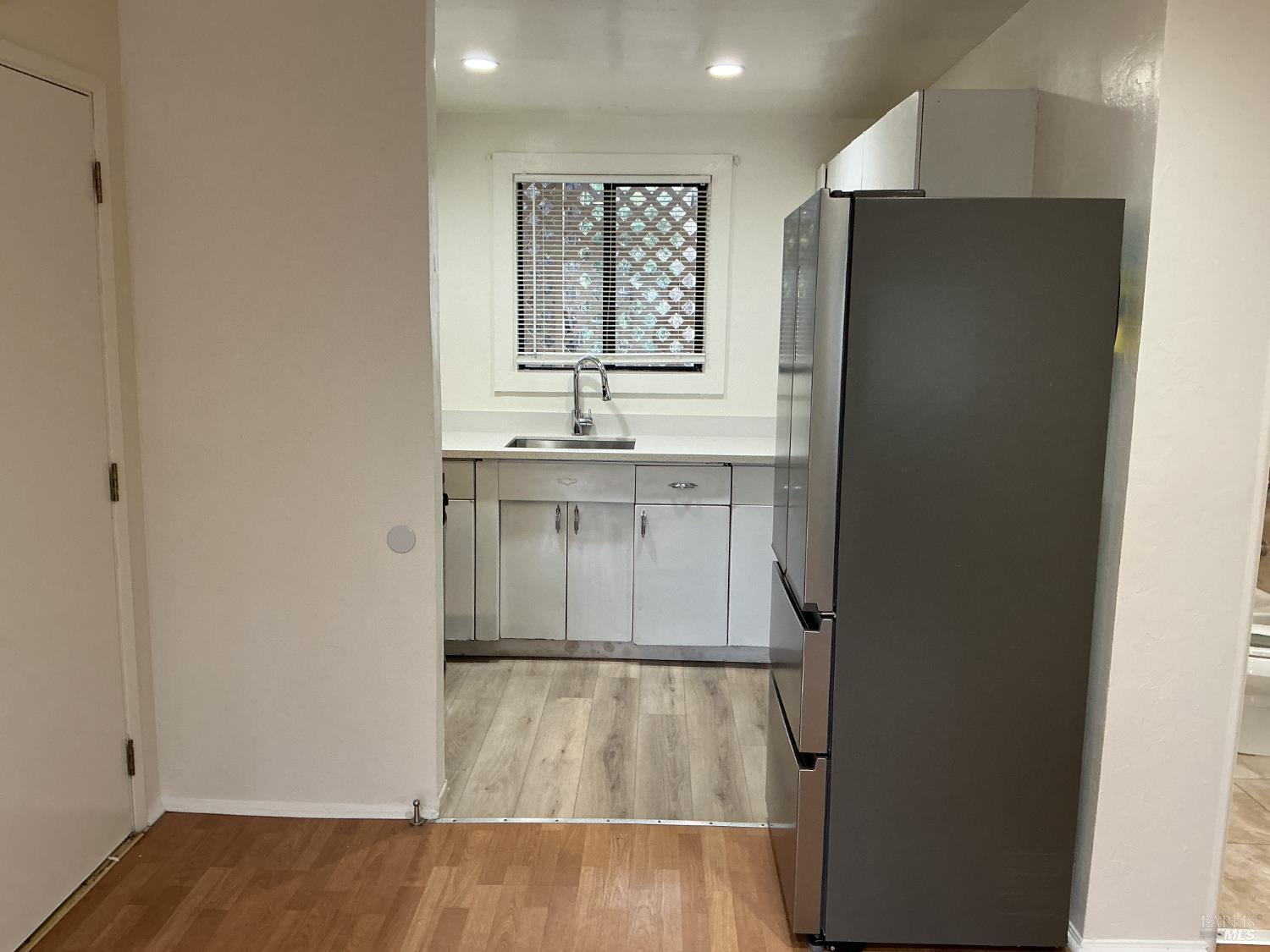 212 South E Street, Unit B Santa Rosa, CA 95404 - Photo 7 of 31 a bathroom with a sink and a mirror