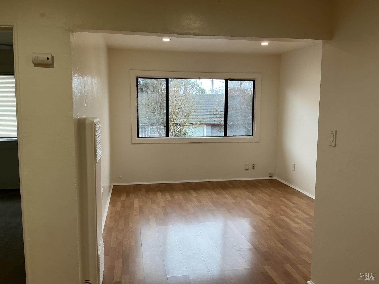 212 South E Street, Unit B Santa Rosa, CA 95404 - Photo 8 of 31 an empty room with a window