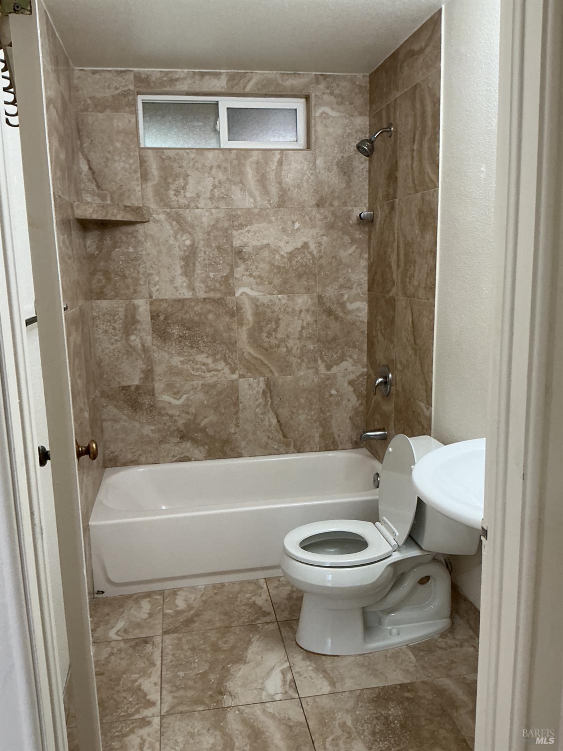 212 South E Street, Unit B Santa Rosa, CA 95404 - Photo 9 of 31 a bathroom with a toilet and a shower