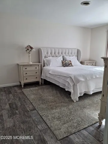 a bathroom with a toilet and a shower curtain
