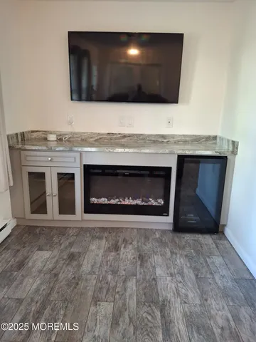 a living room with a washer and dryer