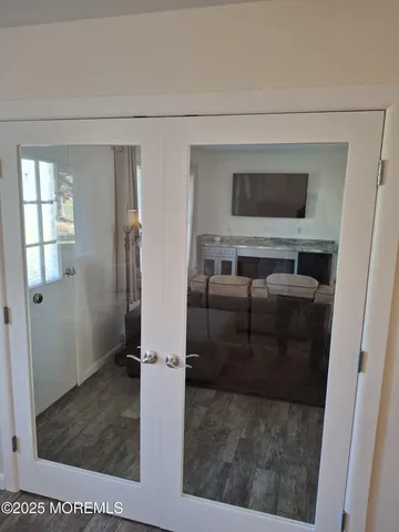 a bathroom with a glass shower door