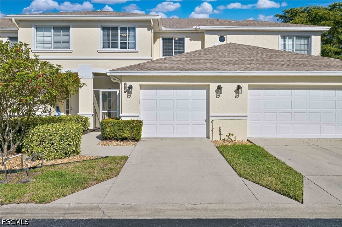 13120 Broadhurst Loop, Unit 505 Fort Myers, FL 33919 - Photo 1 of 28 front view of house and a yard