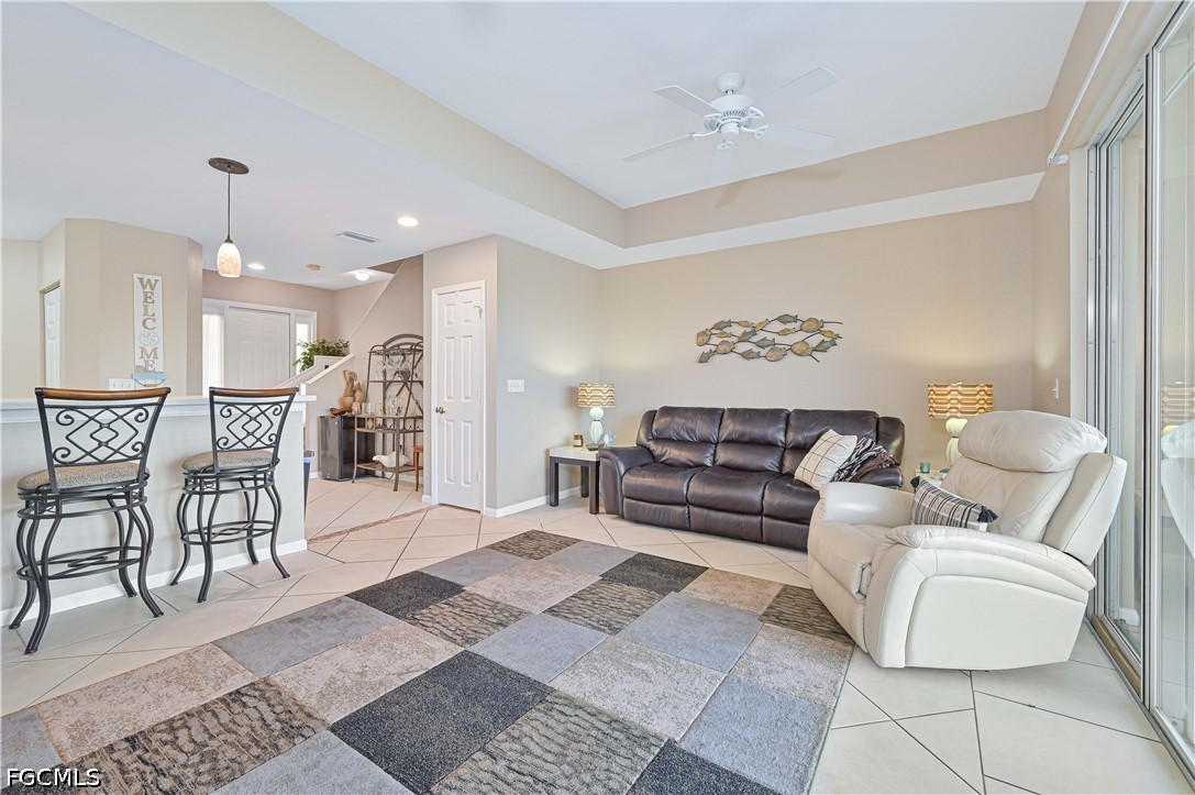 13120 Broadhurst Loop, Unit 505 Fort Myers, FL 33919 - Photo 11 of 28 a living room with furniture and a rug