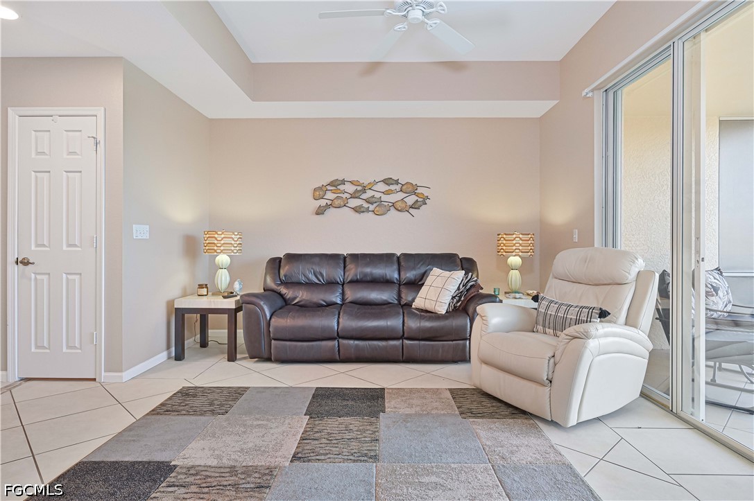13120 Broadhurst Loop, Unit 505 Fort Myers, FL 33919 - Photo 12 of 28 a living room with furniture and a large window