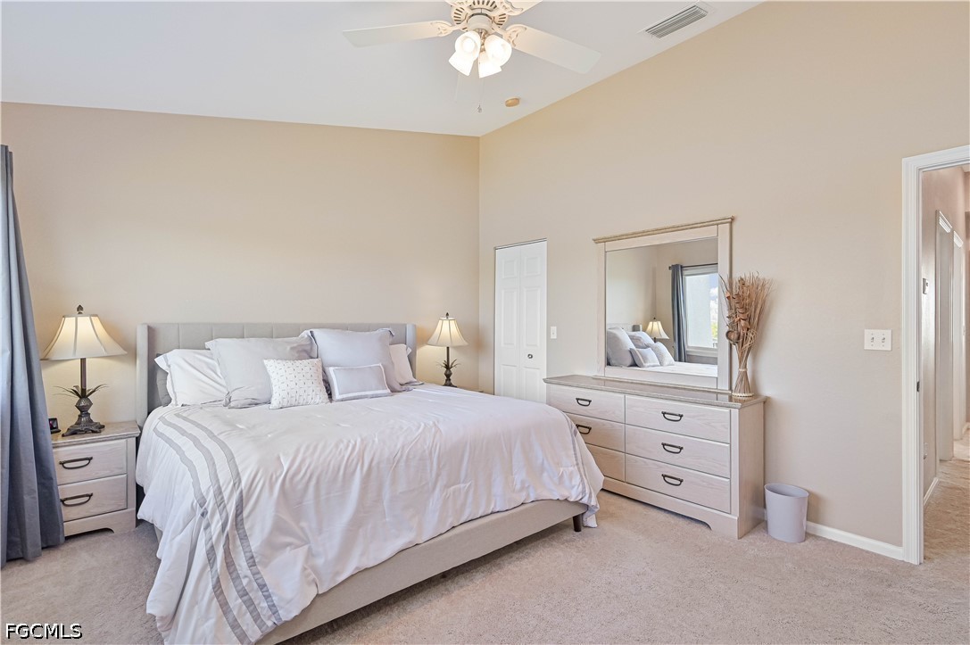 13120 Broadhurst Loop, Unit 505 Fort Myers, FL 33919 - Photo 20 of 28 a bedroom with a bed and a dresser