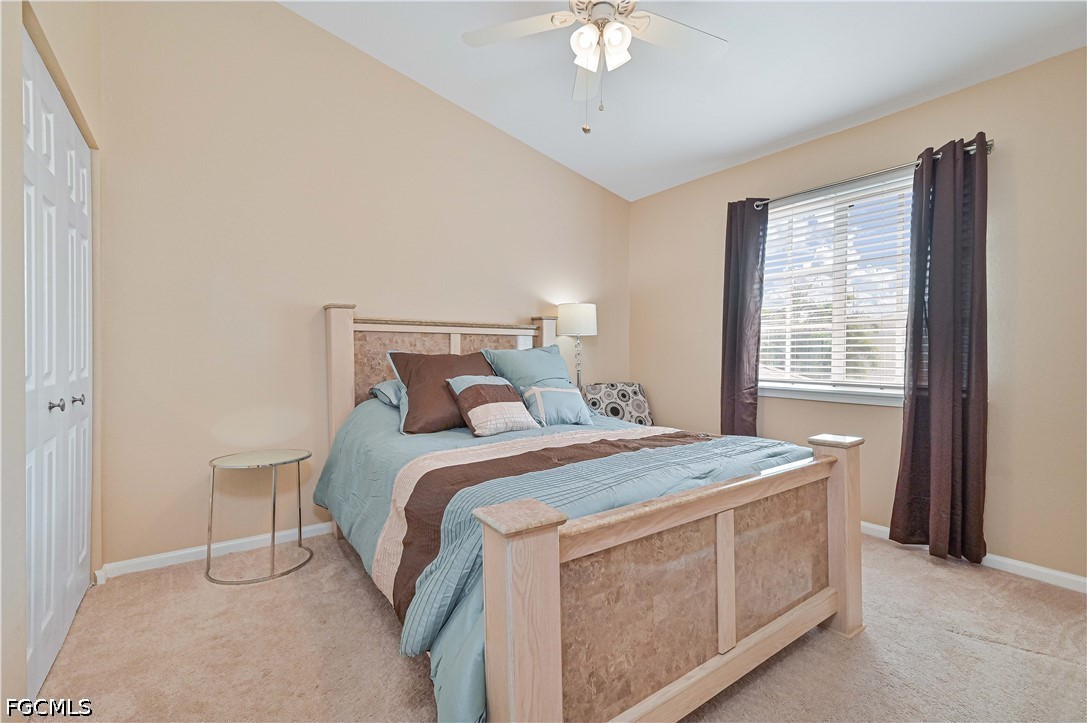 13120 Broadhurst Loop, Unit 505 Fort Myers, FL 33919 - Photo 24 of 28 a bed sitting in a bedroom next to a window