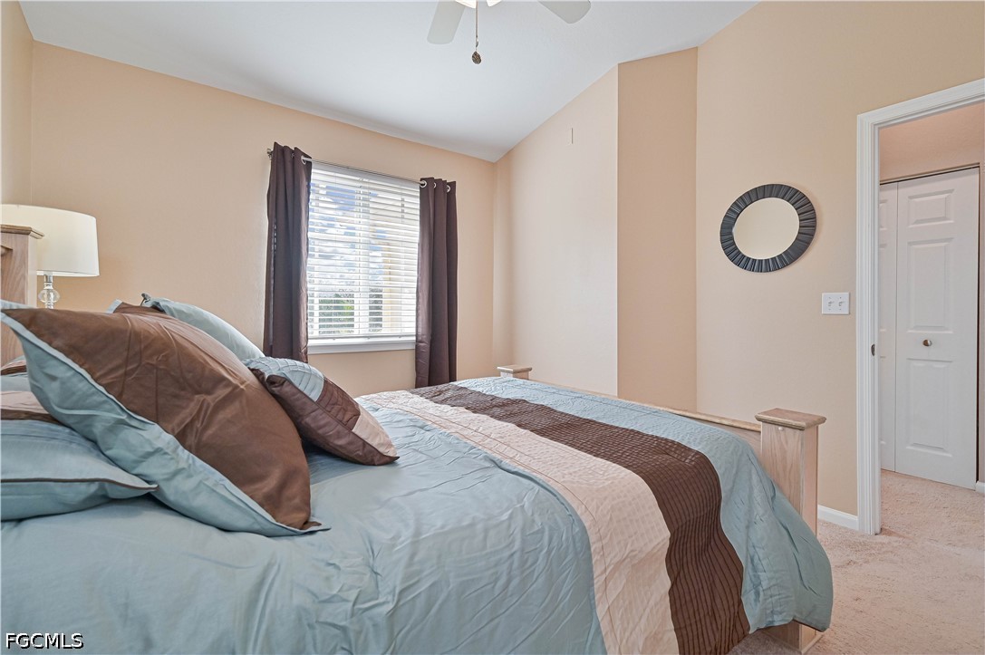 13120 Broadhurst Loop, Unit 505 Fort Myers, FL 33919 - Photo 25 of 28 a bedroom with a bed and a window
