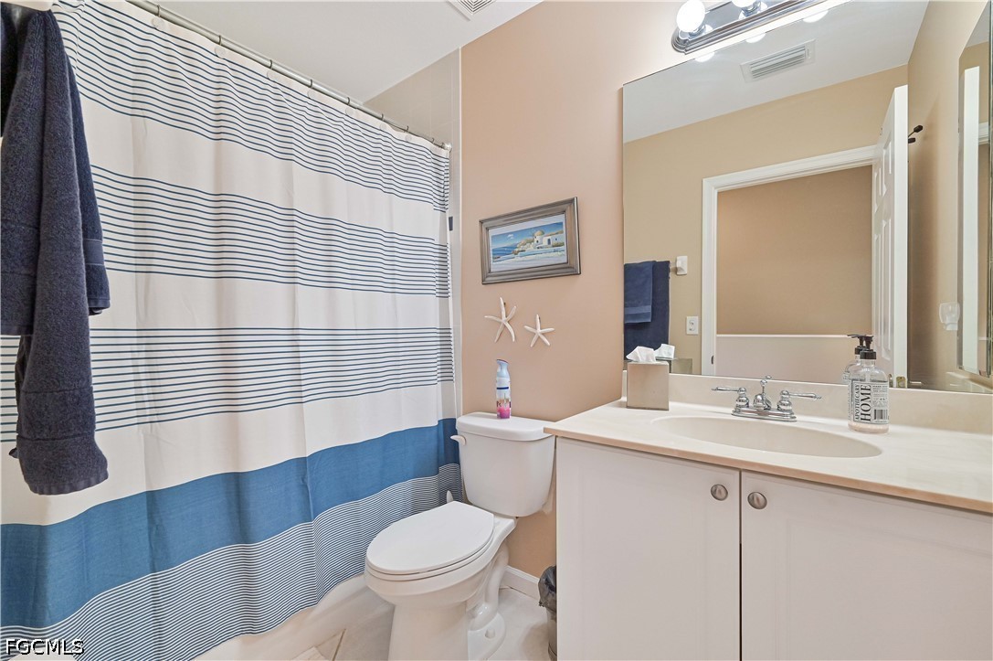 13120 Broadhurst Loop, Unit 505 Fort Myers, FL 33919 - Photo 27 of 28 a bathroom with a sink toilet and shower