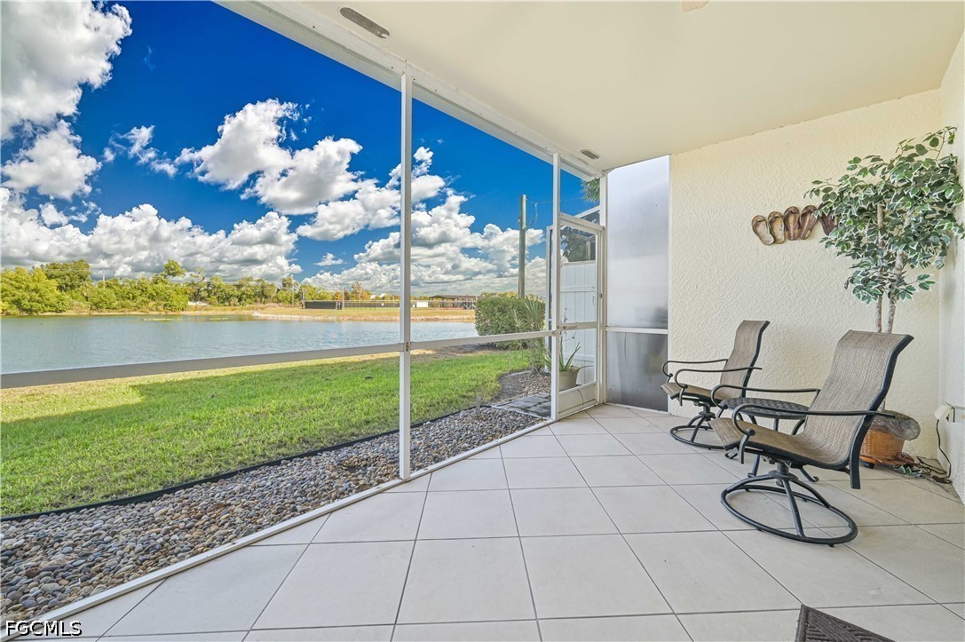 13120 Broadhurst Loop, Unit 505 Fort Myers, FL 33919 - Photo 3 of 28 a view of a porch with chairs and backyard